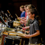 Students drum at spring concert