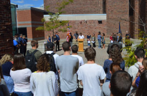 Students speak at podium during 9/11 remembrance ceremony
