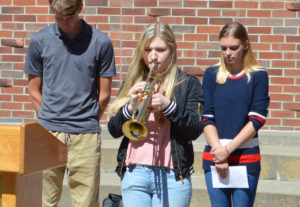 Student plays taps on trumpet