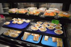 Sandwiches and salads in display case