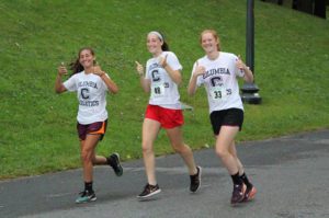 Students running in Teal Ribbon Run in Albany's Washington Park