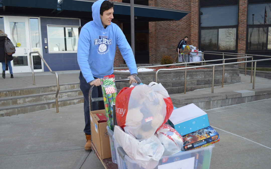 Athletics Delivers Presents for Adopt-a-Families
