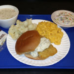 Fish sandwich on a lunch tray