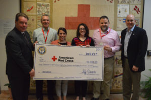 Superintendent Jeff Simons presents a donation on behalf of East Greenbush Central School District to the American Red Cross