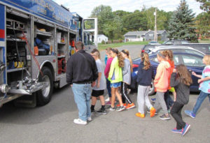 Students look at fire truck