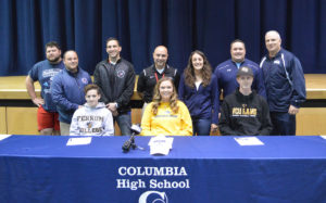 Columbia High School student athletes with family