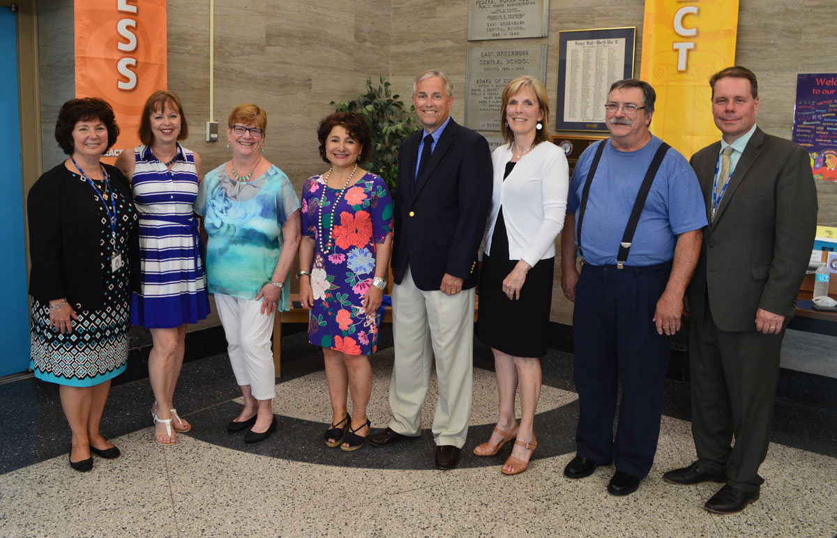 Retiring staff members are recognized at a Board of Education meeting