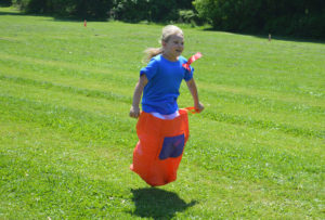 Student in a sack race