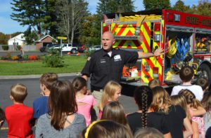 Firefighter teaches students about fire safety