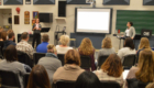 Teachers listen to professional development presentation