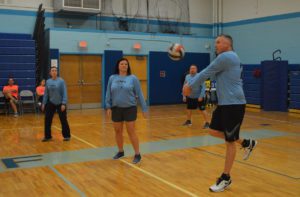 Teachers and staff playing volleyball