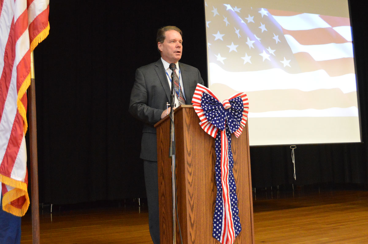 Jeff Simons speaking at Green Meadow Veterans Day assembly