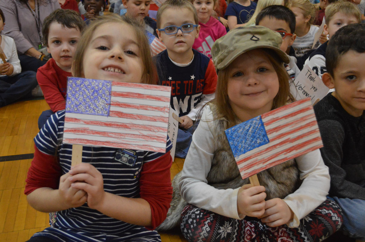 Students holding American flags
