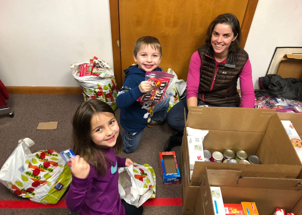 Teacher and kids volunteering