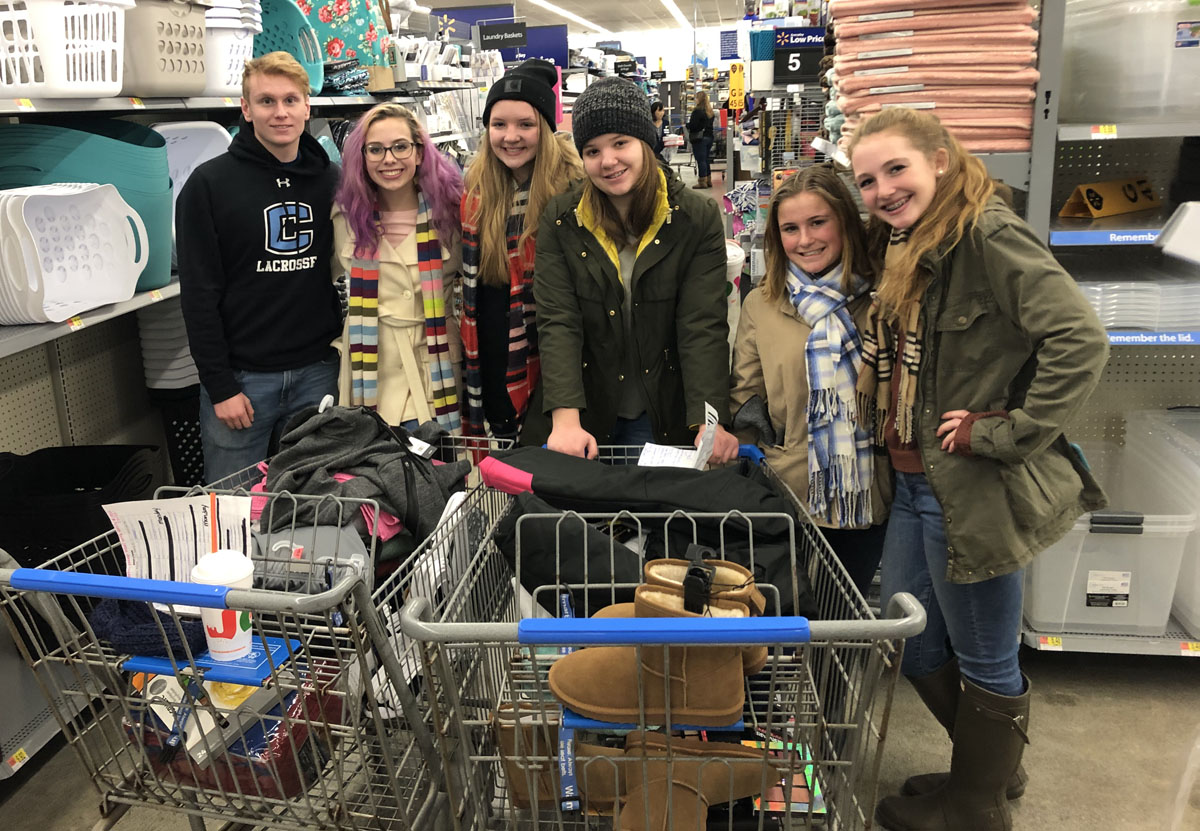 Students shopping for adopt-a-families