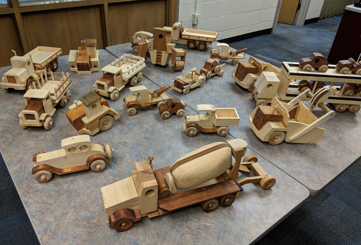 Wooden toy cars and trucks