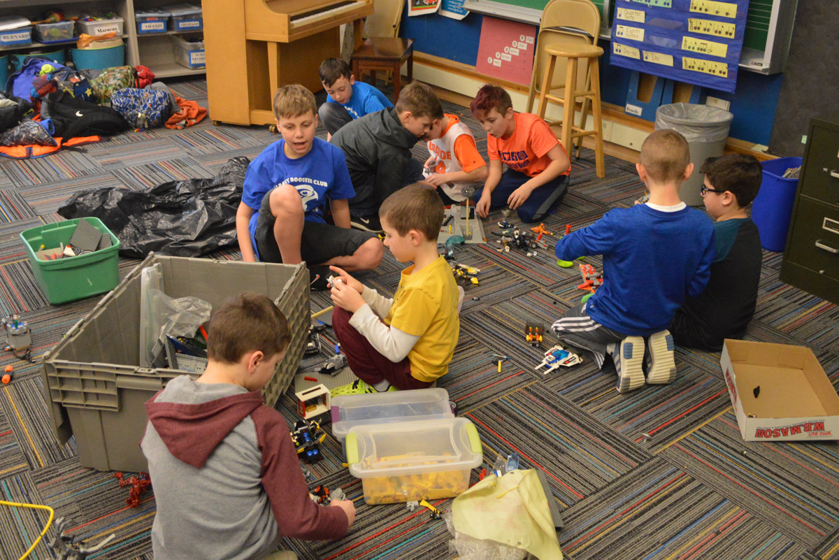 Students playing with Legos after school