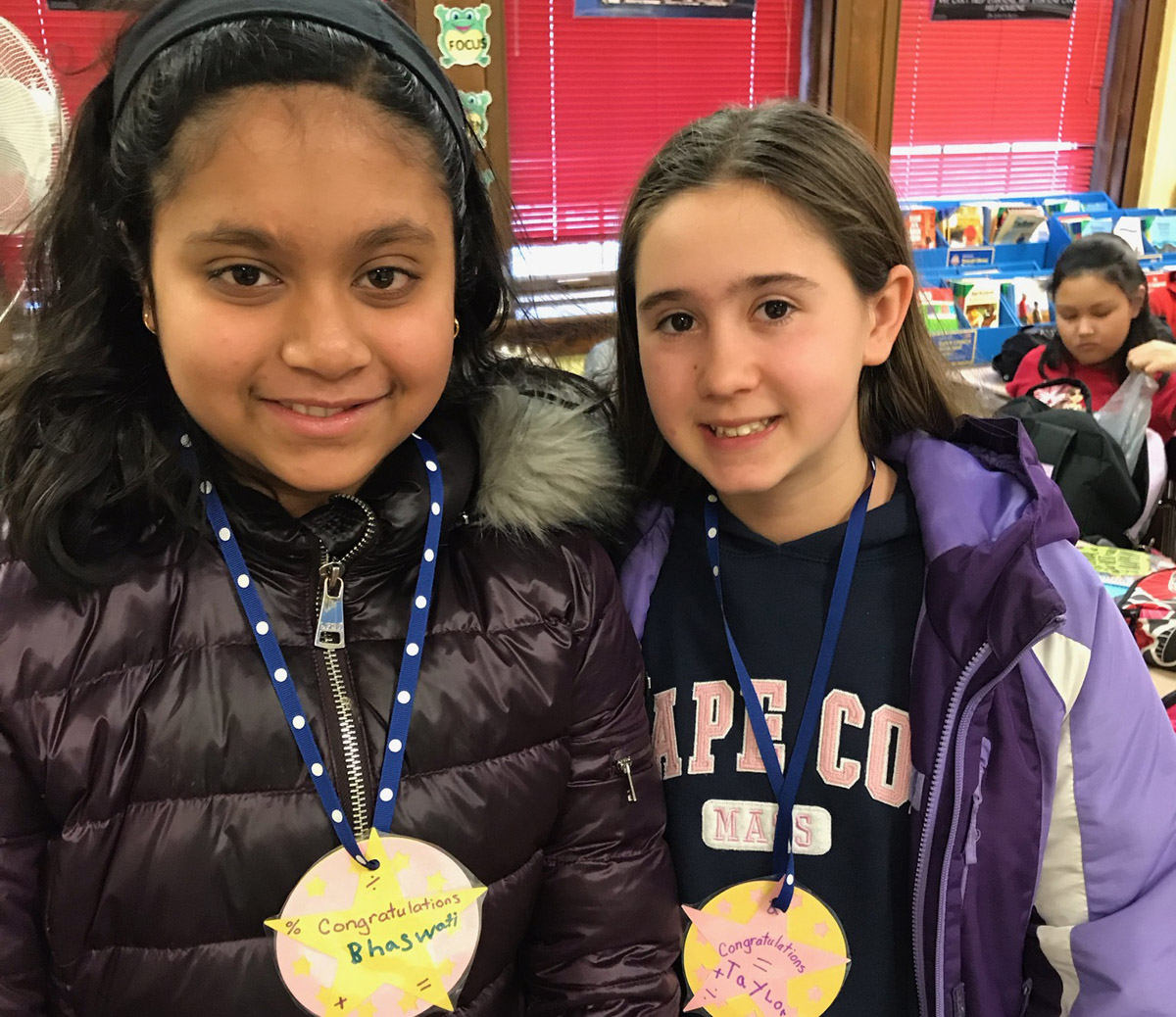 Bhaswati Kar and Taylor Lawrence wearing medals