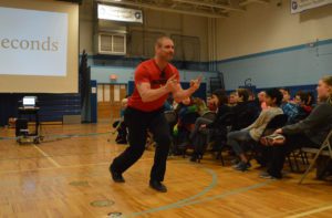 Tom Murphy speaks to students in assembly