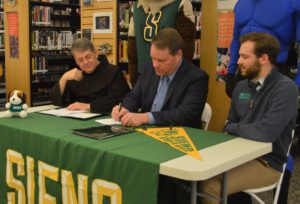 Superintendent Jeff Simons signs partnership with Siena College