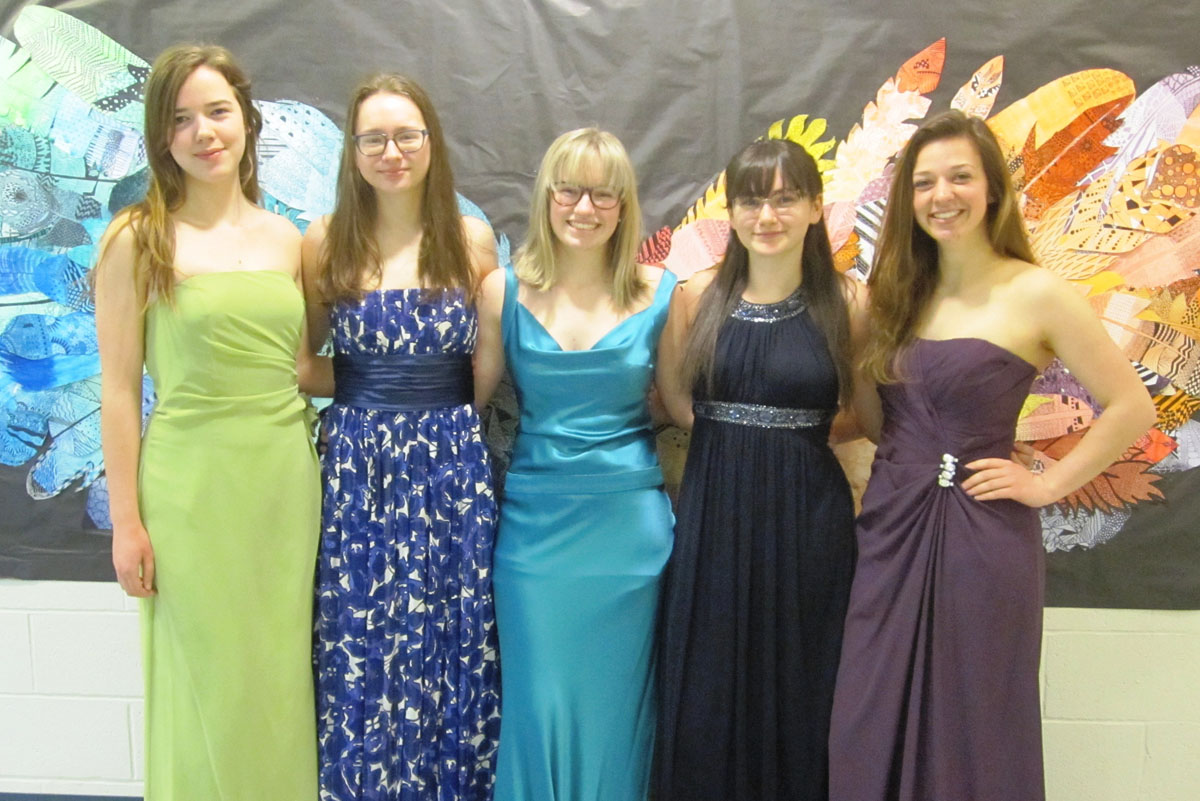 Students wearing prom dresses