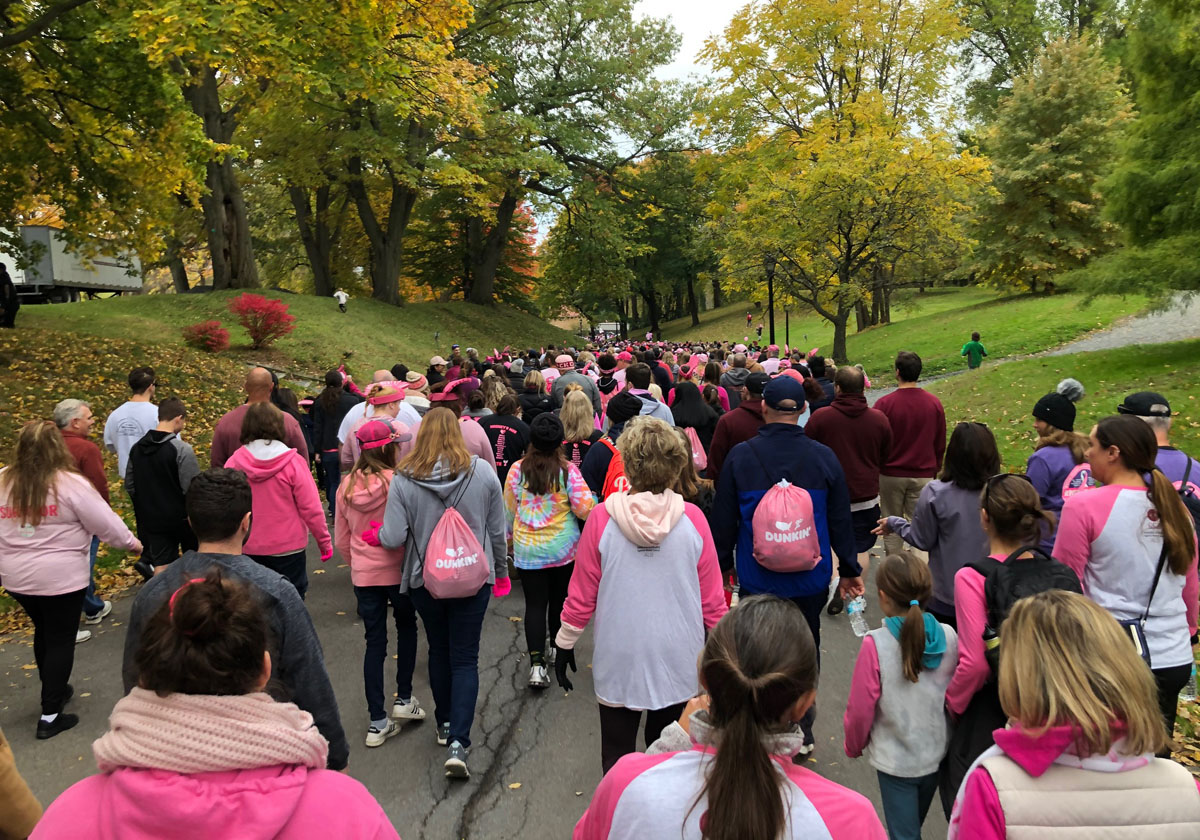People walking through Washington Park in Albany for breast cancer awareness