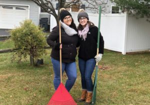 Teachers holding rakes