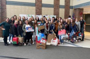 Columbia students with presents for preschool students