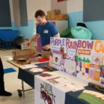 Scott Fuller from Capital Roots serves different varieties of carrots to Goff students and staff at Goff Middle School