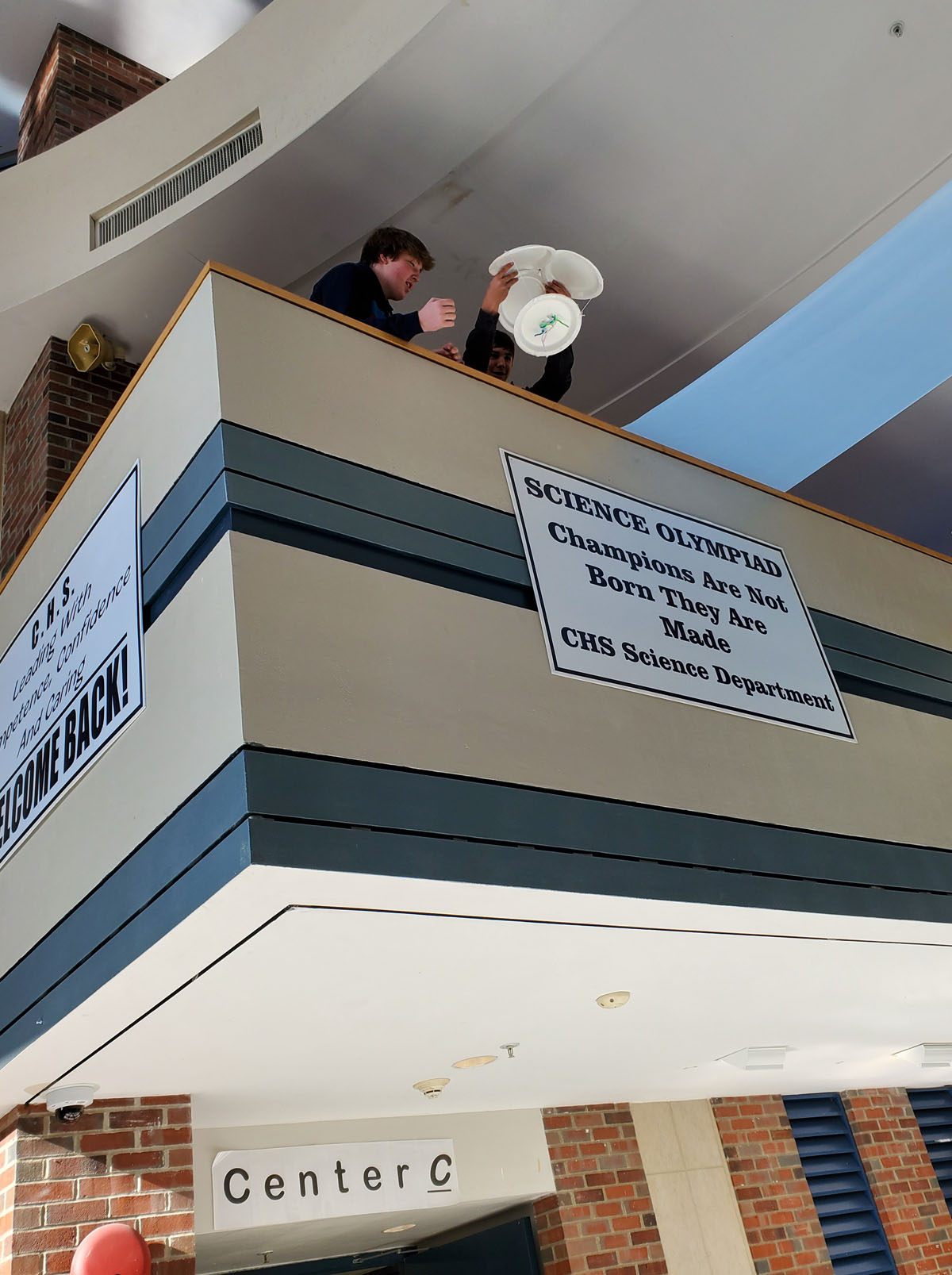 Students drop an egg from the lobby balcony