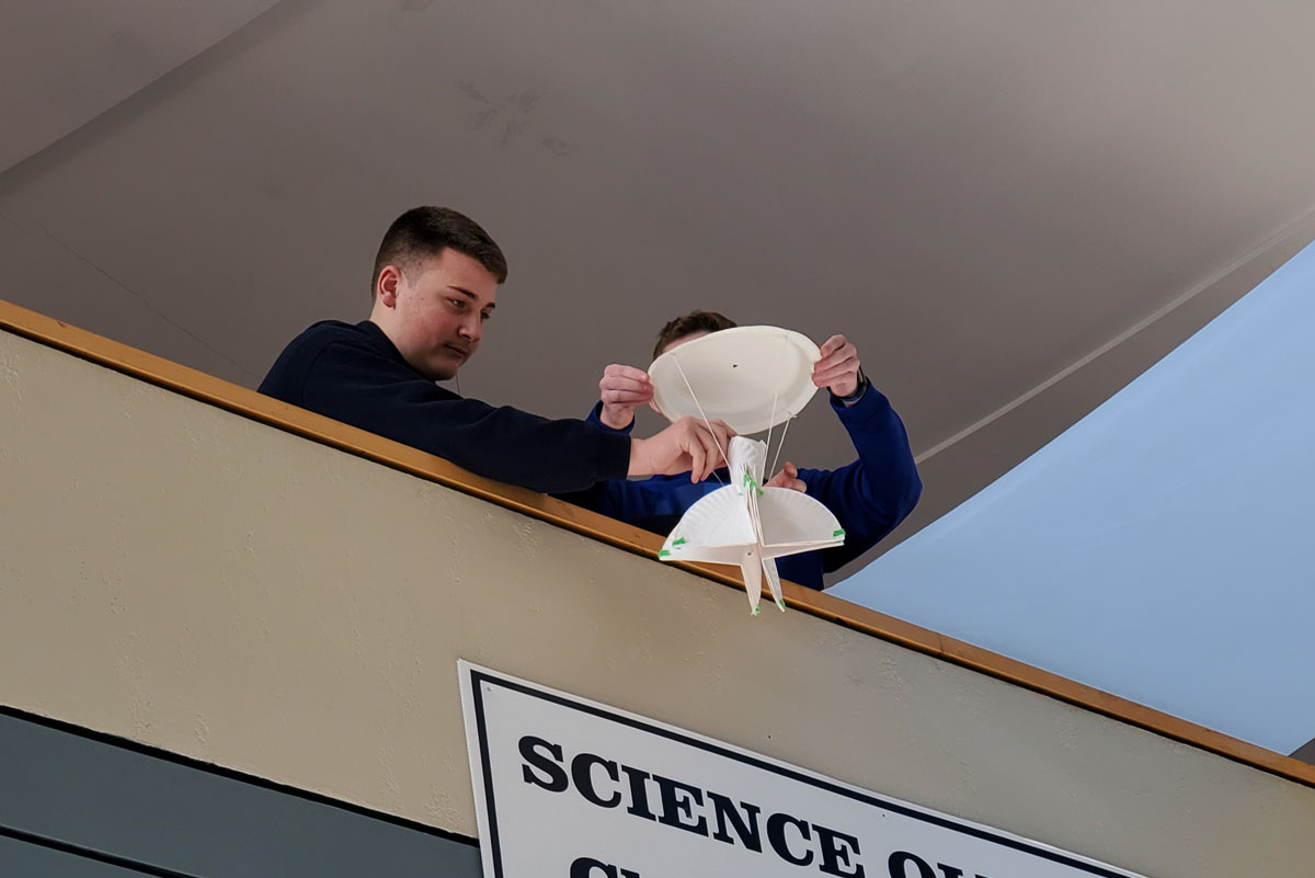 Students drop an egg from the lobby balcony