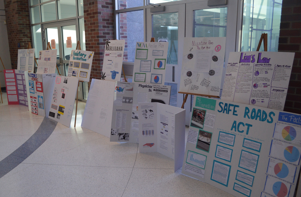 Participation in Government poster boards on display in hallway