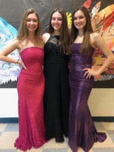 Students wearing prom dresses