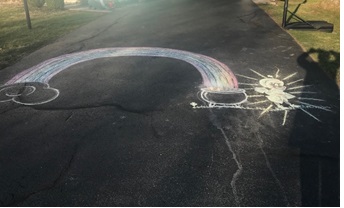Rainbow drawing on driveway