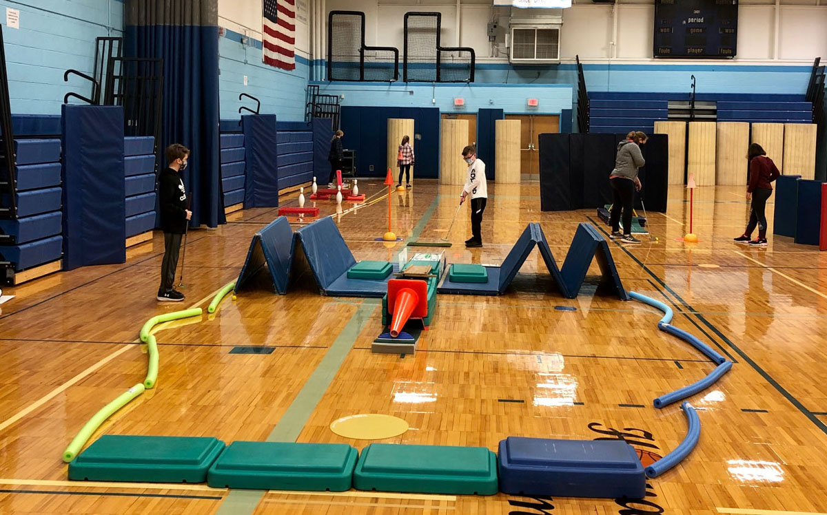 Goff students playing mini golf in the school gym
