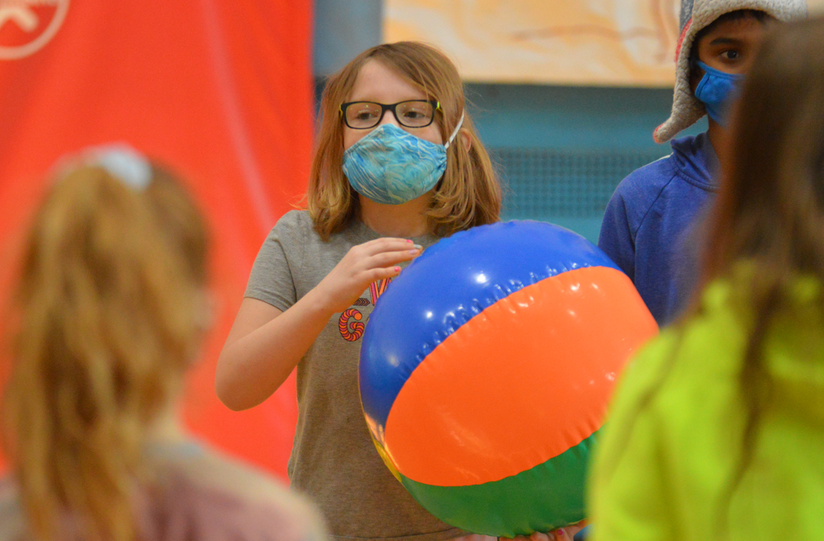 Students playing with beach ball during Project Adventure class