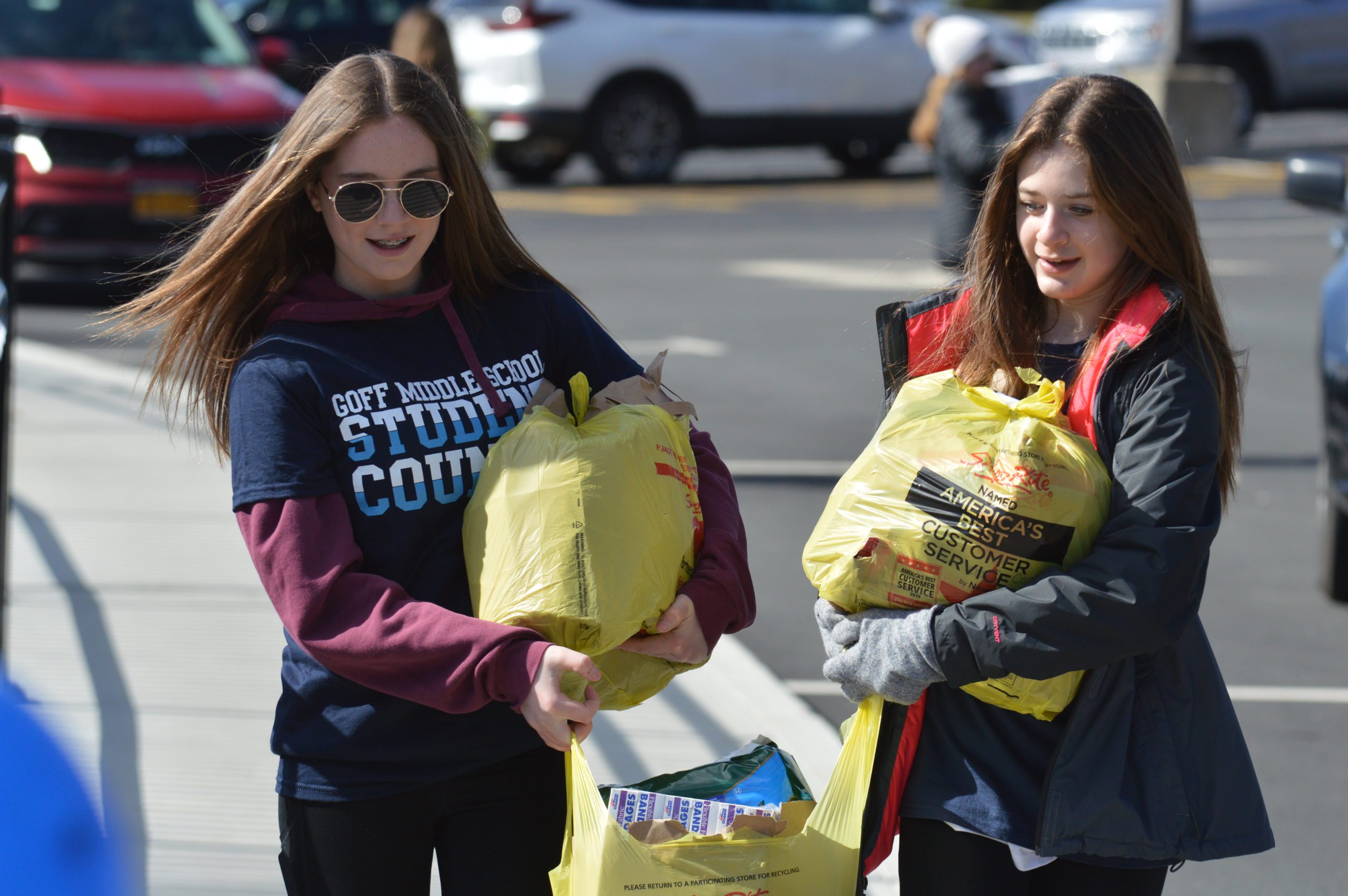 Goff Middle School students carry donations at a Stuff a Bus for Ukraine event