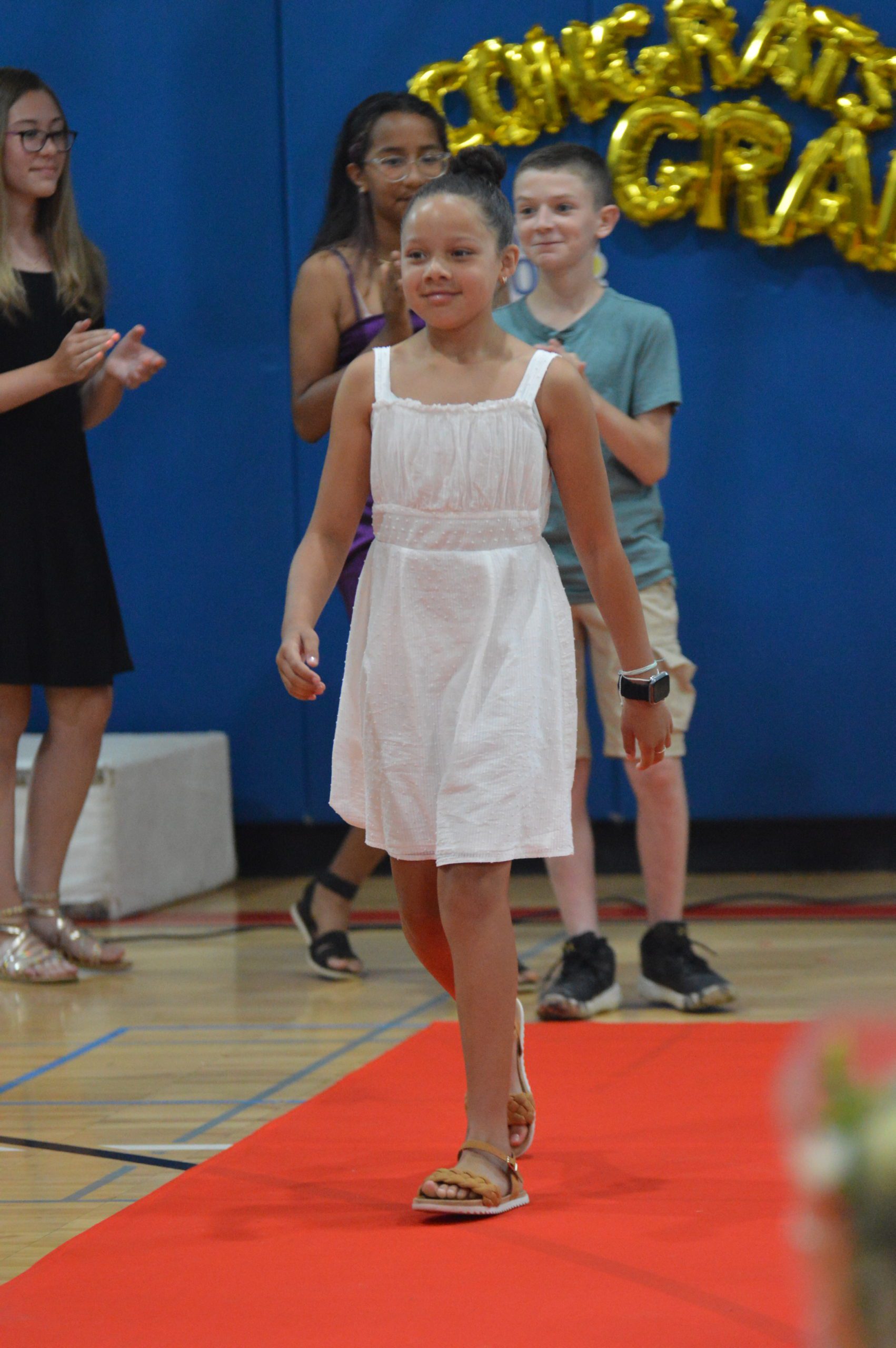 A student at the Red Mill Moving Up Ceremony