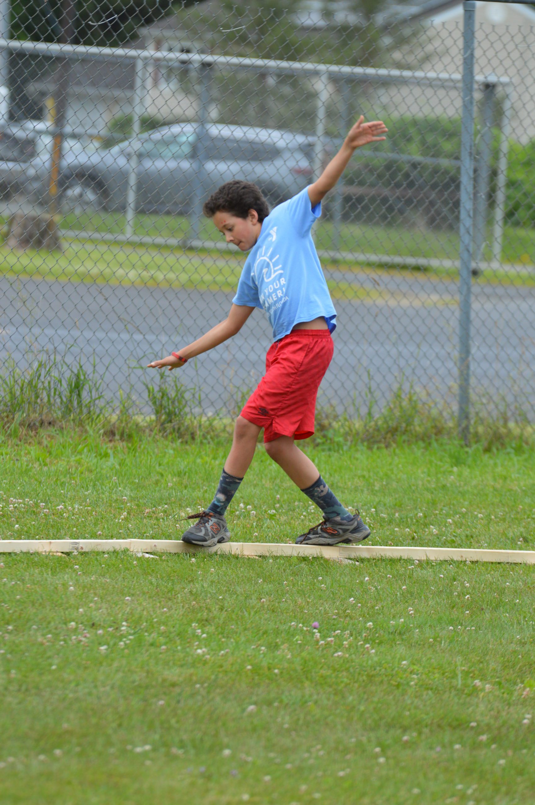 Student goes through obstacle course at Goff Field Day