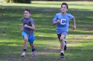Students running in the 2021 Green Meadow Apple Race