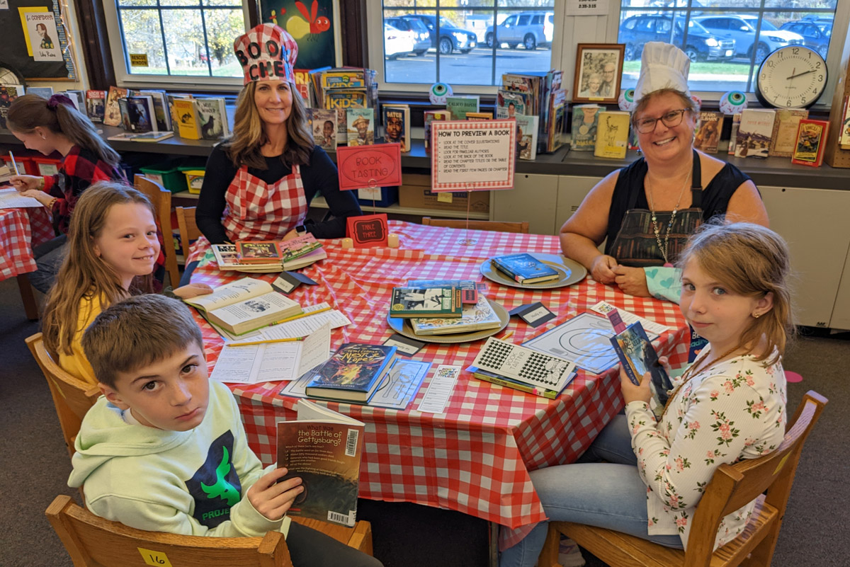 Students at a Book Tasting in the DPS library