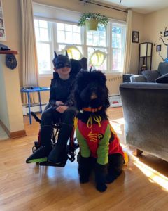 Killian and his new therapy dog Zag dressed up as Batman and Robin for Halloween.