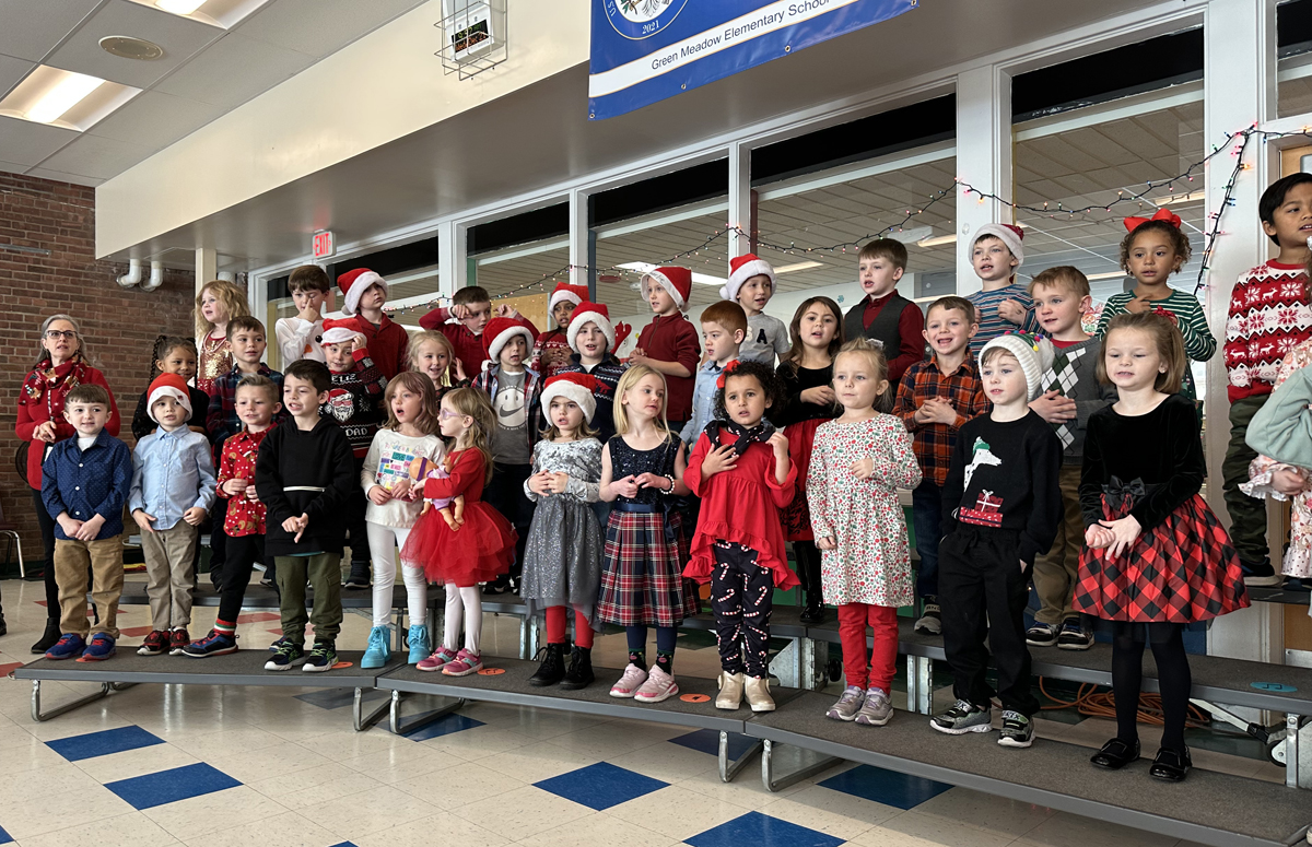 Green Meadow kindergarten students singing at a holiday concert