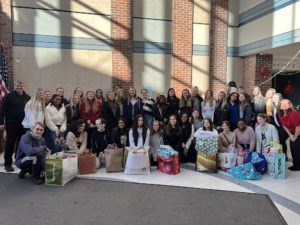 Columbia students with Christmas gifts