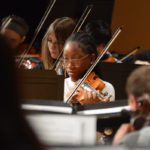 A student performs at the District-wide Instrumental Festival