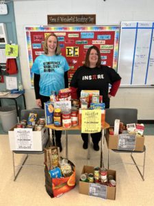 Teachers collecting non-perishable food for the Backpack Program as part of Pi Day