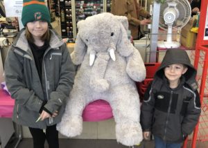 Students with Veda the stuffed elephant at Family Dollar in Nassau