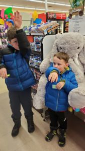 Students with Veda the stuffed elephant at Family Dollar in Nassau