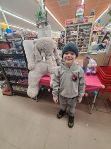A student with Veda the stuffed elephant at Family Dollar in Nassau