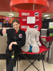 A student with Veda the stuffed elephant at Hannaford in East Greenbush